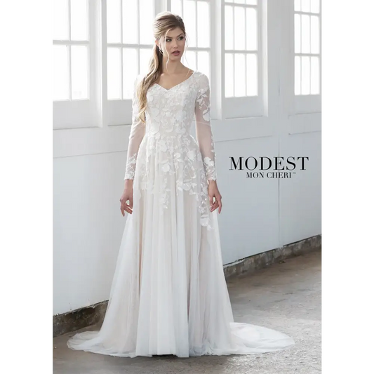 Stunning embroidered, sequin and beaded lace appliqués take center stage in this flowing tulle A-line gown with modesty cap sleeves under illusion lace long sleeves, a beaded curved slight V-neckline, a dropped waist, a concealed back zipper, and a softy gathered tulle skirt with a chapel train. Modest illusion long sleeve utah wedding gown #utahbridalshop #weddinggowns #sandyutah #bridalcloset #brides #bridalshop #utahwedding #designerweddings #templeready #weddingaccessories #modestweddingdress