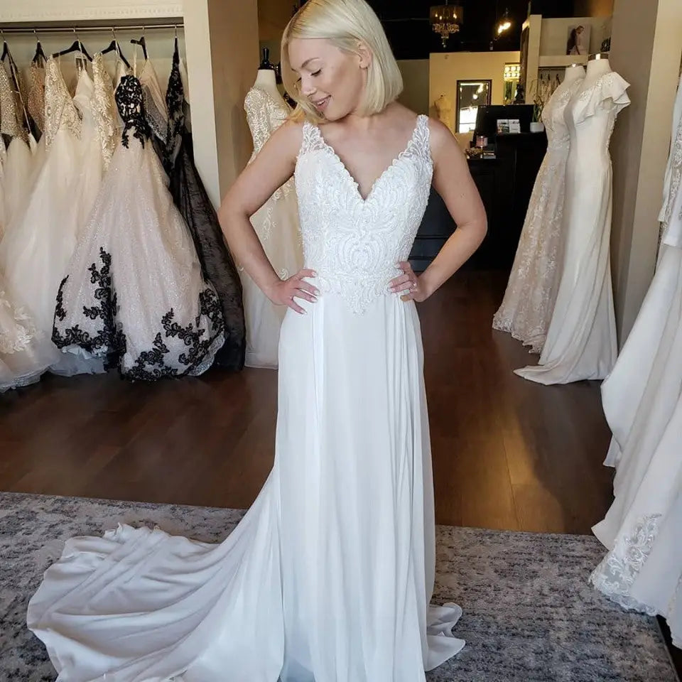 Stunning HJ Collection Gracie wedding gown from the Bridal Closet featuring a lace bodice and flowing skirt. beautiful lace satin wedding gown white dress bridal closet #utahbridalshop #weddingdresses #weddingaccessories #bridalcloset #classyweddings #brides #utahweddings #designerweddinggowns #gorgeousgowns #trendyweddingdresses #uniqueweddinggowns 