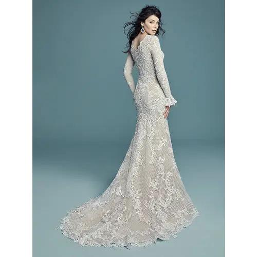 Maggie Sottero redefined couture bridal fashion with its commitment to impeccable styling and incomparable fit at an affordable price.  flattering fit zip closure bell cuffs shapewear long sleeves #utahbridalshop #modestweddingdress #modest #longsleeves #bridalshop #bridalcloset #weddinggown #bride #lacegown #weddingdress #templeready