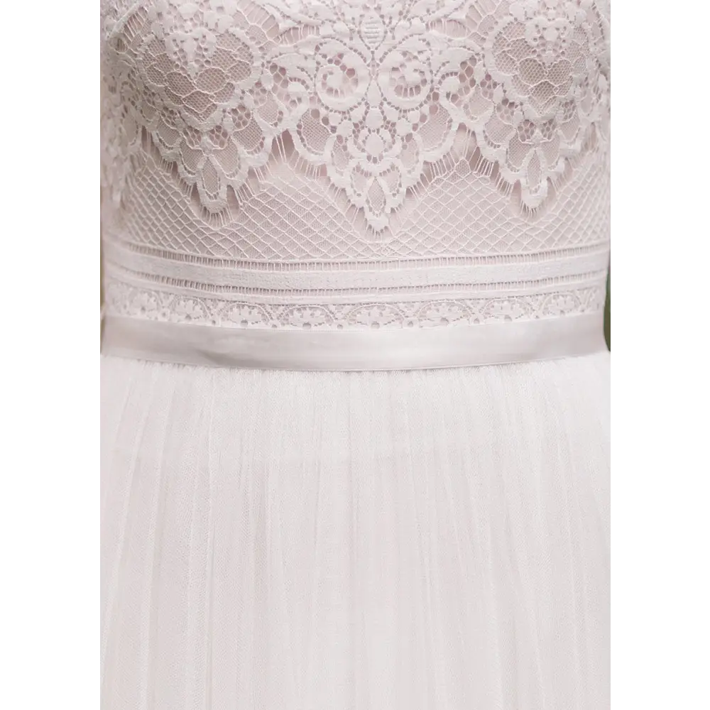 Modest wedding dresses that offer both classic style and on-trend design, this collection of wedding dresses with sleeves honors your traditions, values and integrity. All over lace accented with tulle and satin ribbon. modest temple ready lace designer dress #utahbridalshop #weddingdresses #weddingaccessories #bridalcloset #classyweddings #brides #utahweddings #designerweddinggowns #modestgowns #trendyweddingdresses #uniqueweddinggowns 